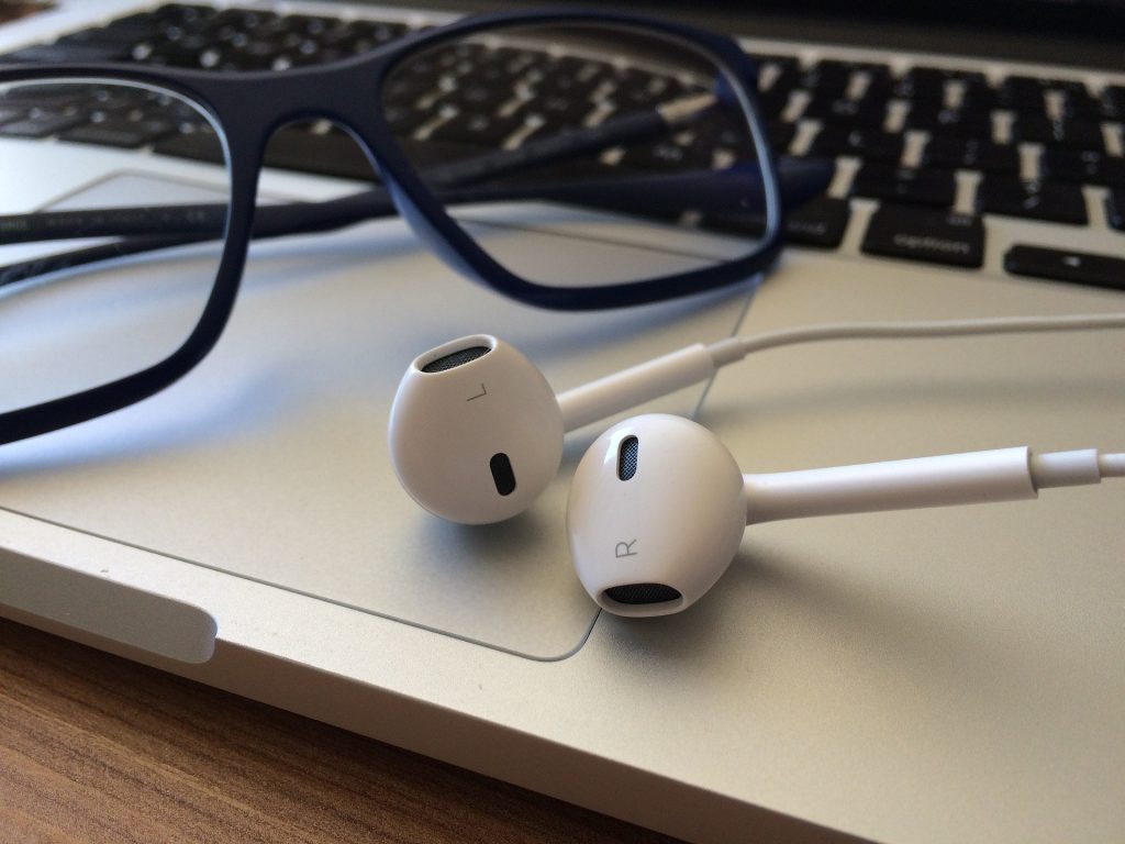 apple headphones on laptop